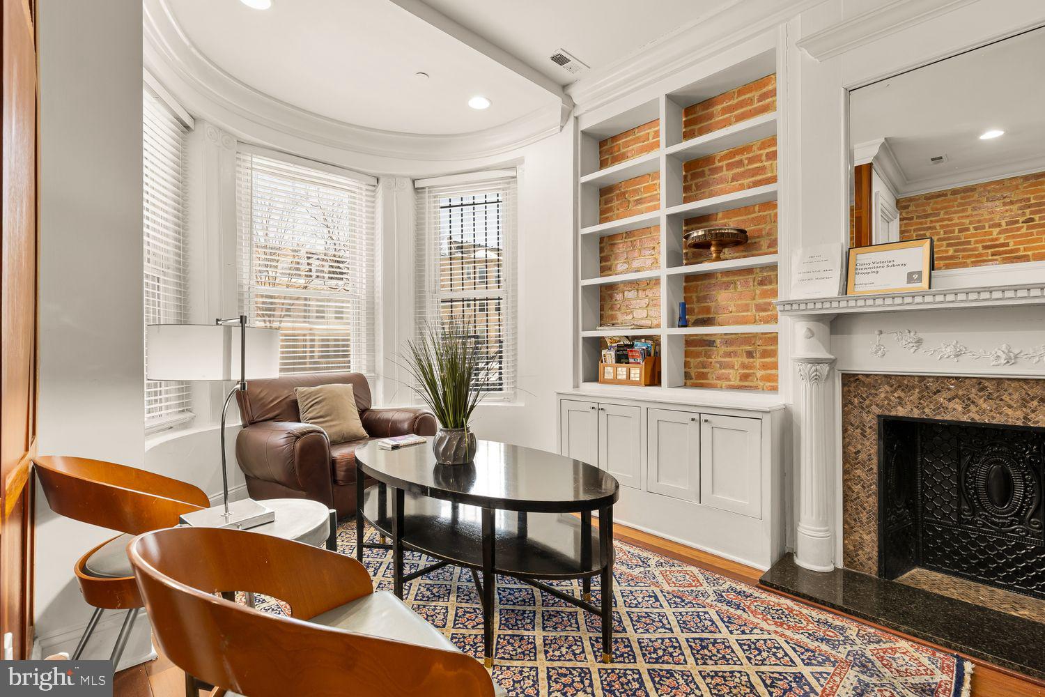 2814 13th Street Northwest Washington, DC 20009 - Photo 4 of 35 a dining room with furniture and a fireplace