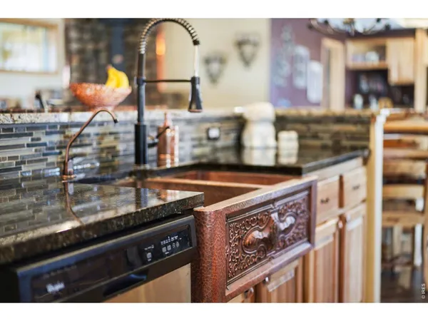 a kitchen area with stove and cabinets