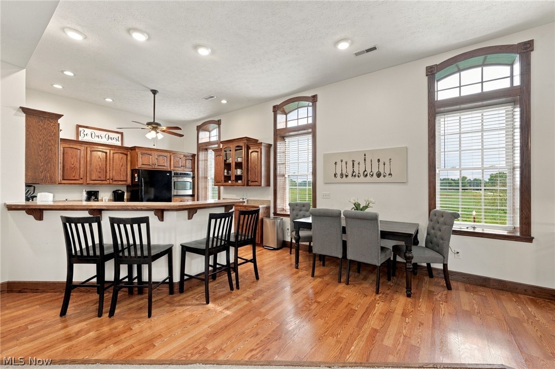 42764 Russia Road Elyria, OH 44035 - Photo 17 of 50 Kitchen with wood-finish flooring, recessed lighting, and a ceiling fan