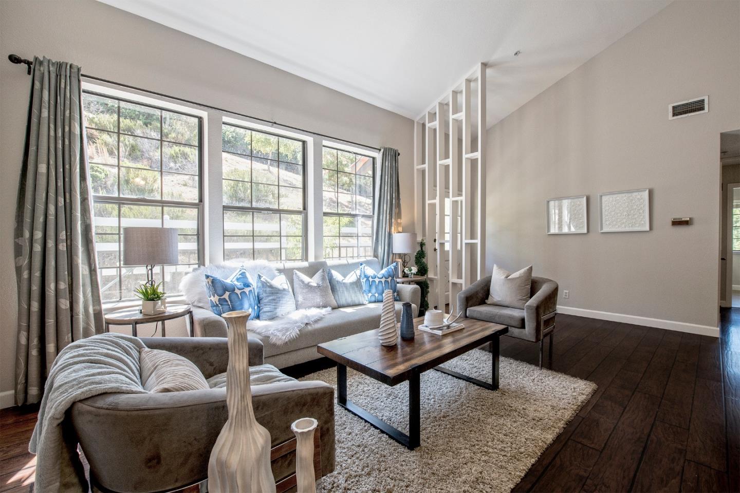 22344 Regnart Road Cupertino, CA 95014 - Photo 16 of 20 a living room with furniture and a large window