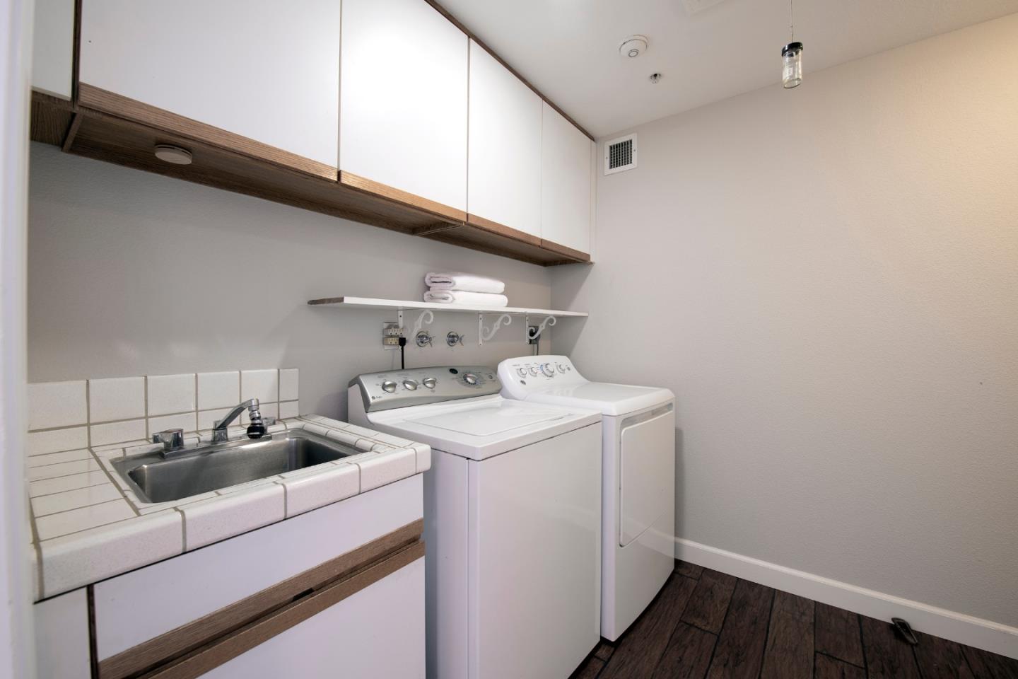 22344 Regnart Road Cupertino, CA 95014 - Photo 18 of 20 a utility room with dryer and washer