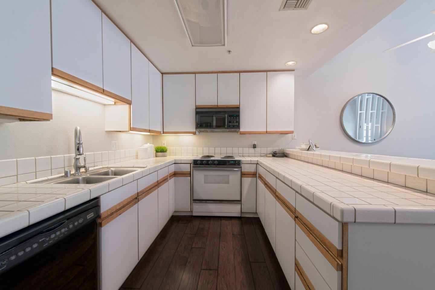 22344 Regnart Road Cupertino, CA 95014 - Photo 19 of 20 a kitchen with a sink dishwasher a stove and a oven