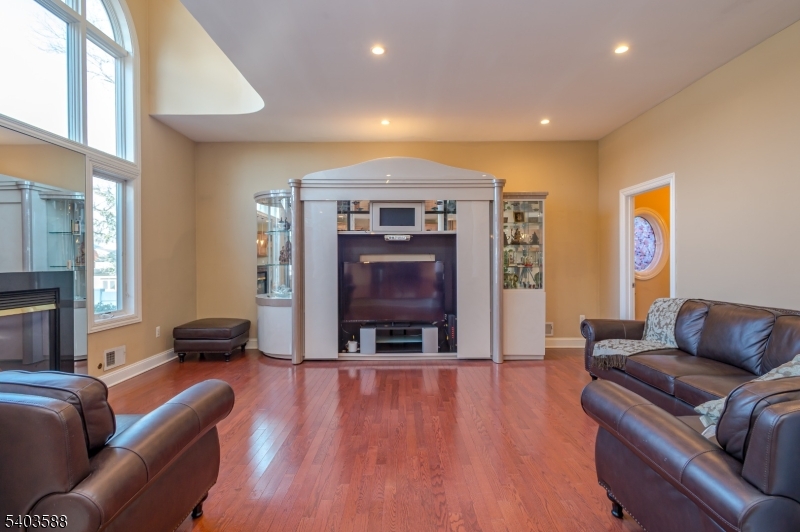 53 Princeton Avenue Woodbridge, NJ 07067 - Photo 20 of 37 a living room with furniture and a fireplace
