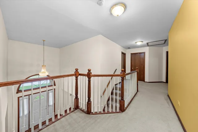 a view of a hallway with stairs