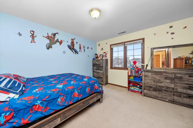 a bedroom with bed and window