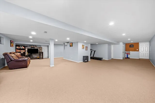 a big room with furniture and a couch