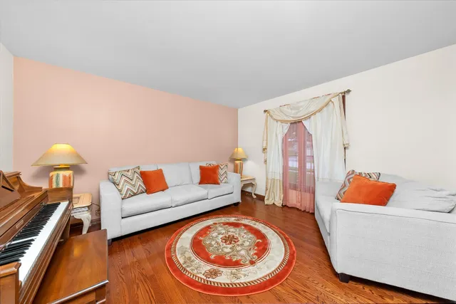 a living room with furniture and a lamp