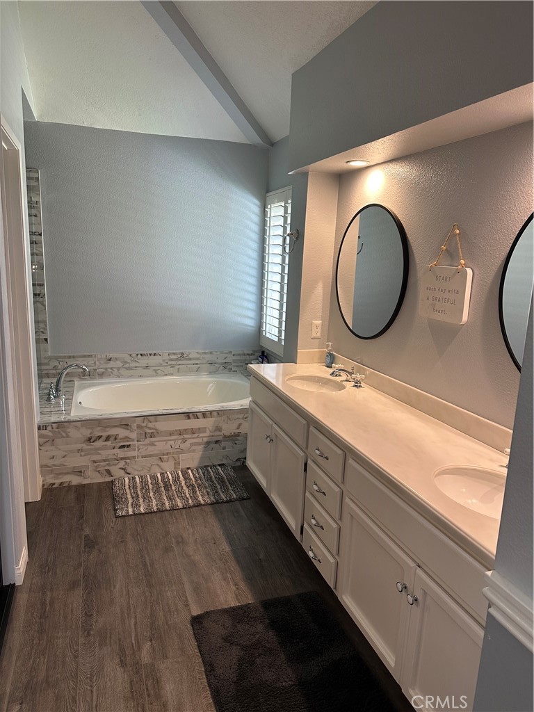 855 Ave Bernardo San Dimas, CA 91773 - Photo 4 of 7 a bathroom with a double vanity sink and a mirror