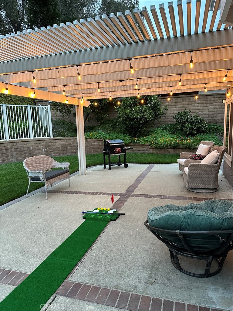 855 Ave Bernardo San Dimas, CA 91773 - Photo 6 of 7 a view of a patio with a table chairs and a yard