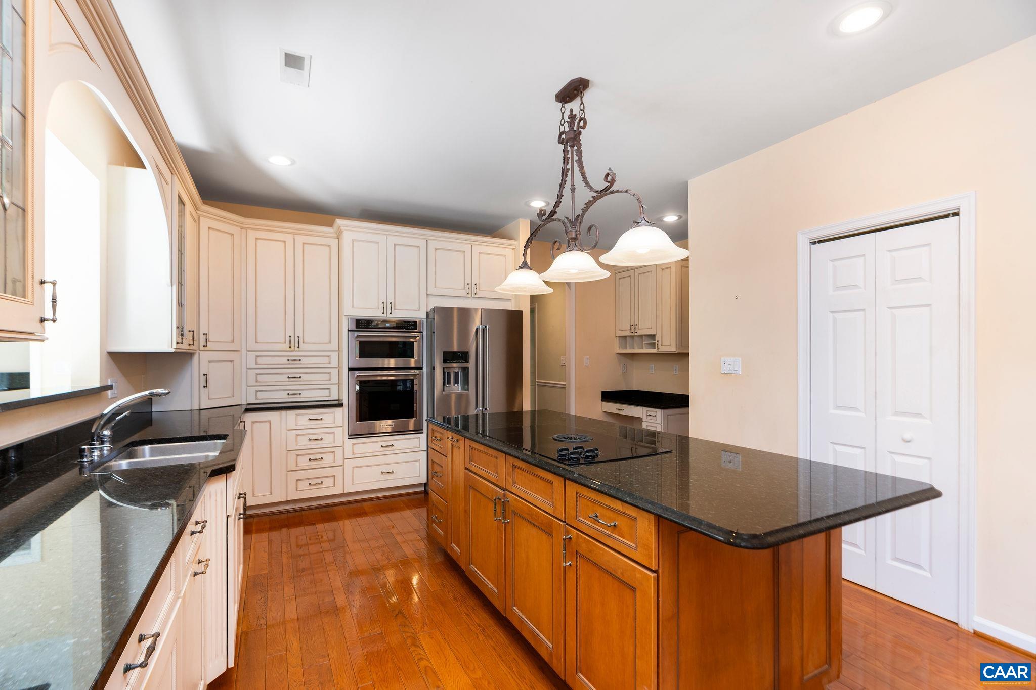 21 Amethyst Road Palmyra, VA 22963 - Photo 15 of 66 a kitchen with stainless steel appliances granite countertop a sink refrigerator and cabinets