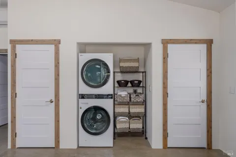 a view of livingroom with washer and dryer