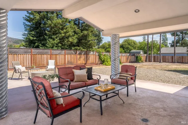 a outdoor space with patio the couches and a dining table with garden view