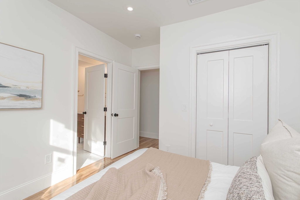 125 Mt Vernon Street, Unit 2 Newton, MA 02465 - Photo 20 of 36 a bedroom with a bed and a window