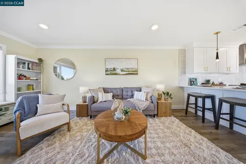 a kitchen with granite countertop a sink stainless steel appliances and cabinets