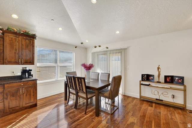 141 Wolverine Creek Elk Ridge, UT 84651 - Photo 12 of 47 Dining room featuring dark wood finished floors, a textured ceiling, and recessed lighting