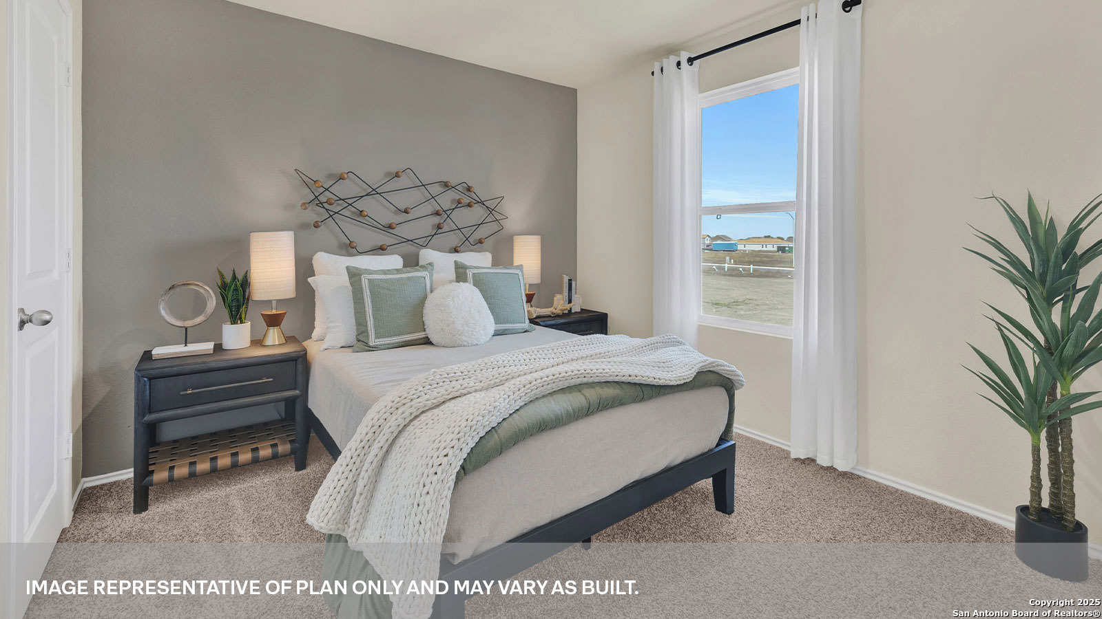 188 Surrey Oaks Maxwell, TX 78656 - Photo 20 of 35 a bedroom with a bed and a potted plant