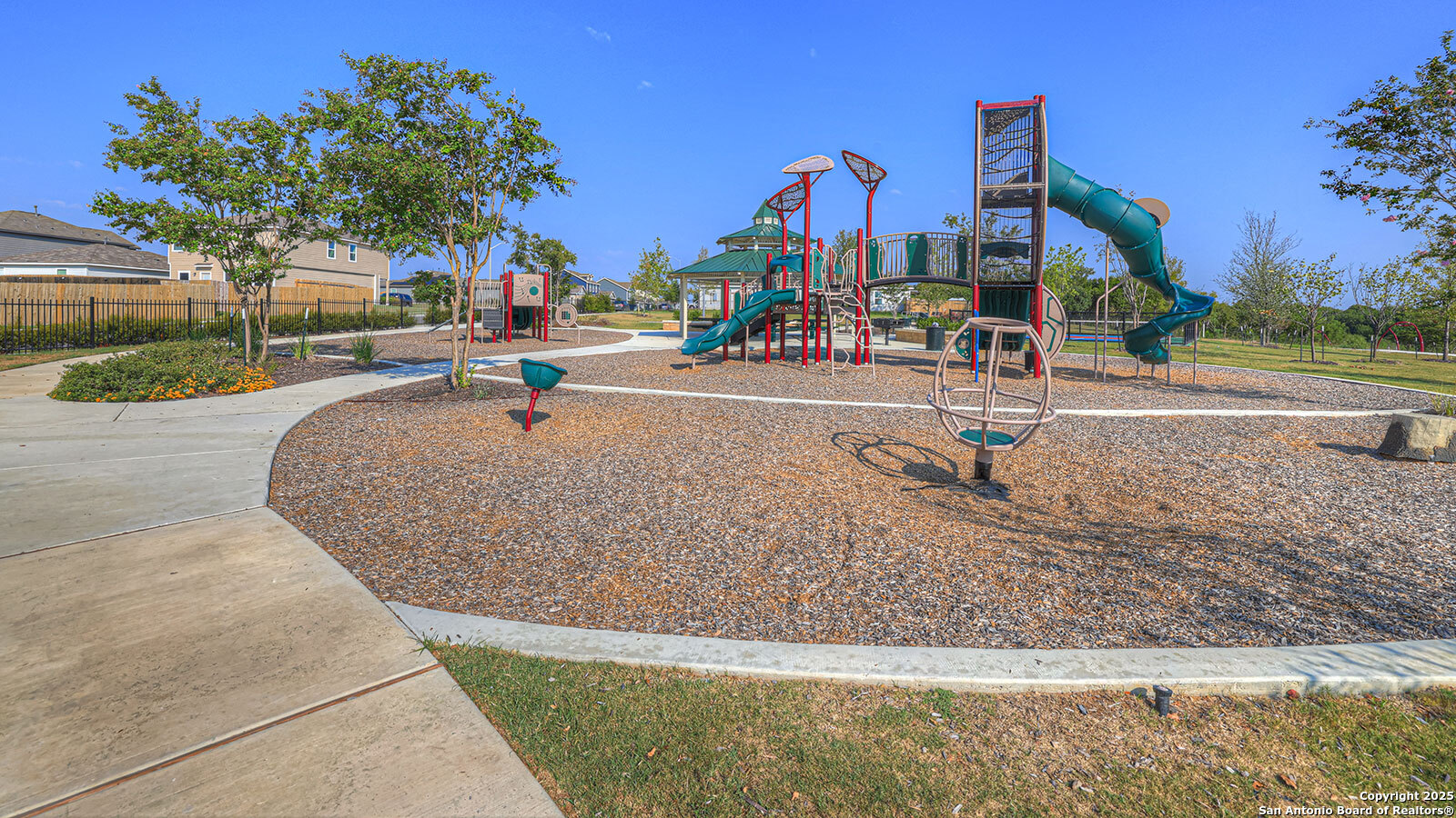 188 Surrey Oaks Maxwell, TX 78656 - Photo 27 of 35 a childrens park with lots of swings and slides