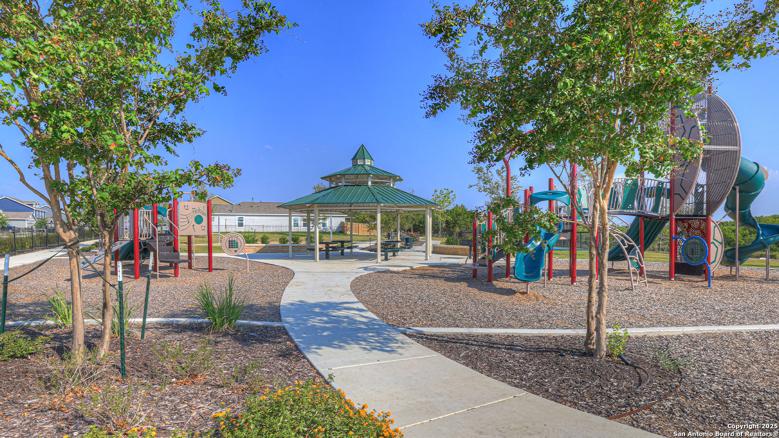 188 Surrey Oaks Maxwell, TX 78656 - Photo 28 of 35 a view of a park with swings and slides