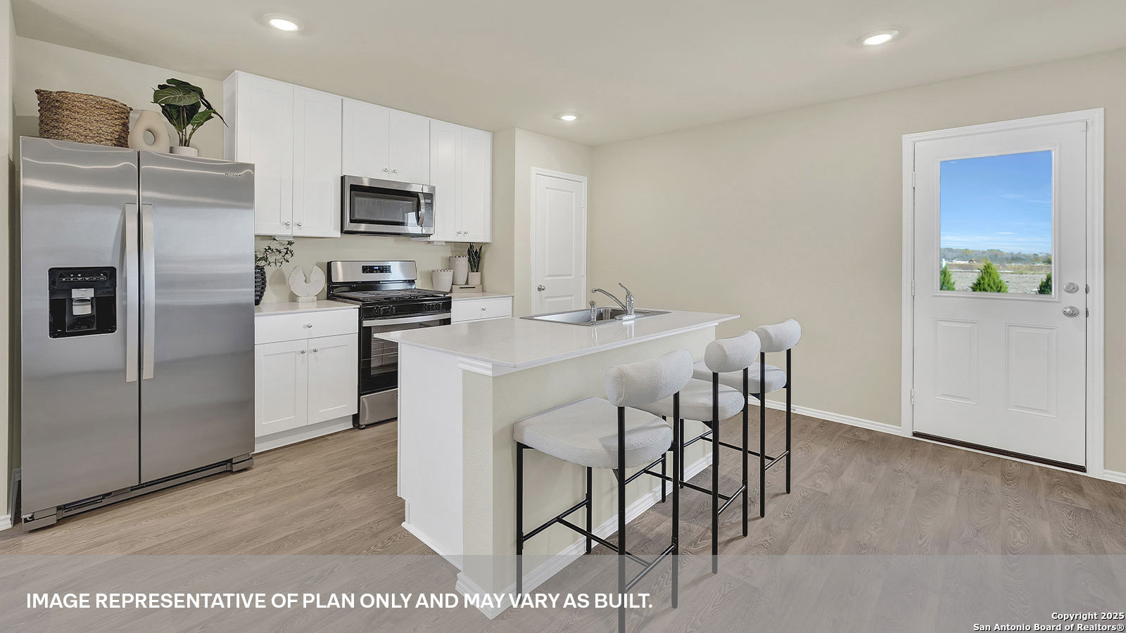 188 Surrey Oaks Maxwell, TX 78656 - Photo 6 of 35 a kitchen with stainless steel appliances a table chairs microwave and refrigerator