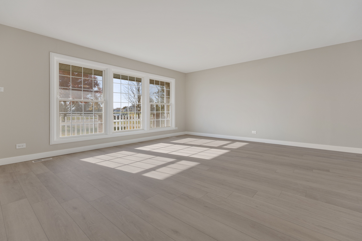 9446 Magnolia Avenue Mokena, IL 60448 - Photo 12 of 38 a view of an empty room with wooden floor and a window