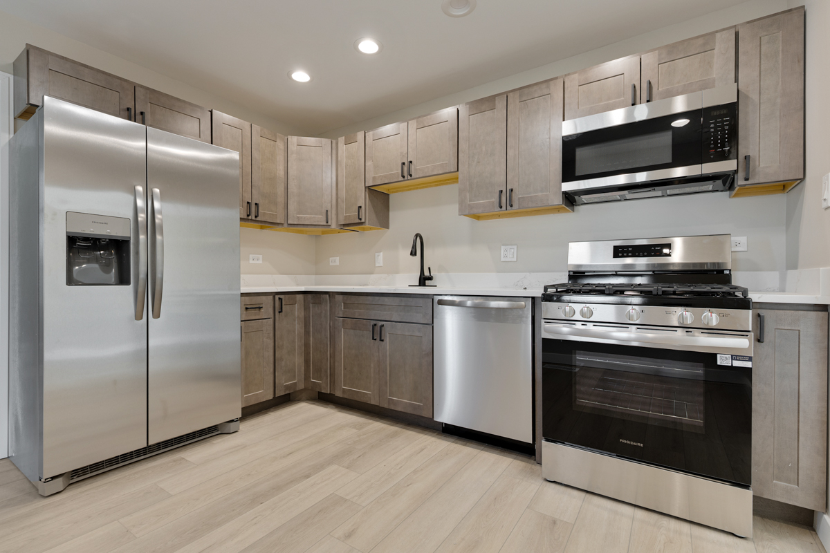 9446 Magnolia Avenue Mokena, IL 60448 - Photo 16 of 38 a kitchen with cabinets stainless steel appliances and wooden floor