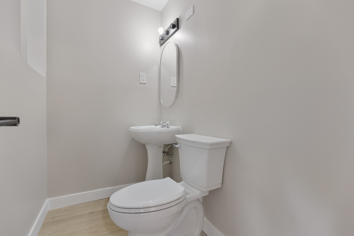 9446 Magnolia Avenue Mokena, IL 60448 - Photo 20 of 38 a white toilet sitting next to a white sink