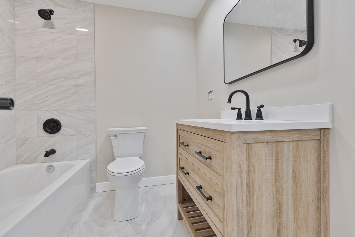 9446 Magnolia Avenue Mokena, IL 60448 - Photo 22 of 38 a bathroom with a sink a toilet and shower