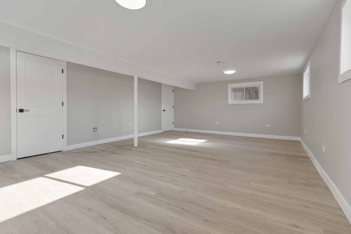 9446 Magnolia Avenue Mokena, IL 60448 - Photo 27 of 38 a view of an empty room with wooden floor and a window