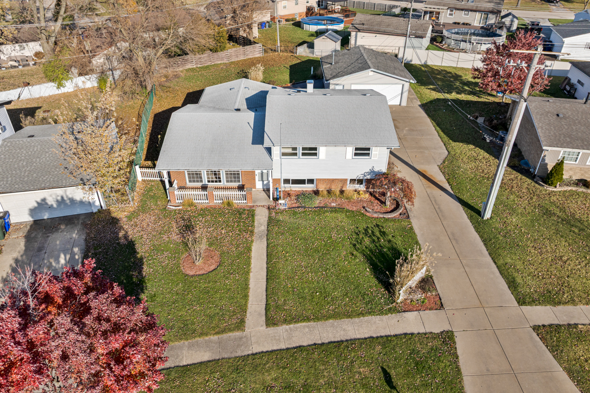 9446 Magnolia Avenue Mokena, IL 60448 - Photo 3 of 38 an aerial view of a house with a garden and large trees