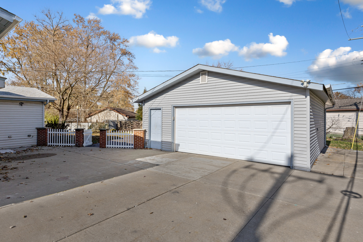 9446 Magnolia Avenue Mokena, IL 60448 - Photo 34 of 38 a view of a house with a yard and garage