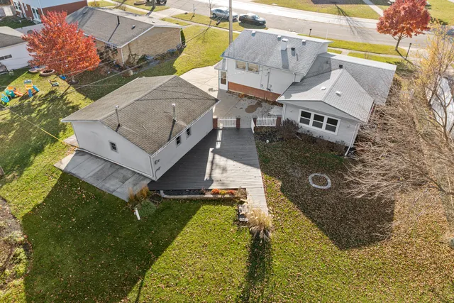 an aerial view of a house with swimming pool