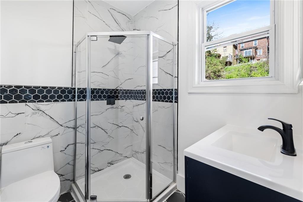 23 Craighead Street Pittsburgh, PA 15211 - Photo 23 of 35 a bathroom with a shower and toilet