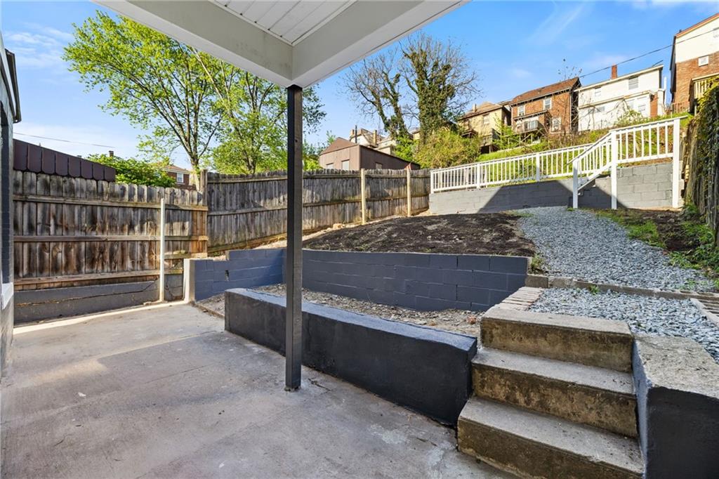 23 Craighead Street Pittsburgh, PA 15211 - Photo 31 of 35 a view of a backyard with wooden fence