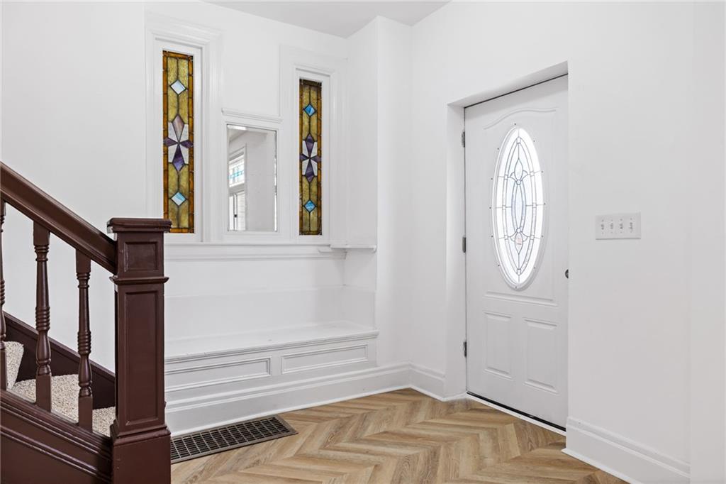 23 Craighead Street Pittsburgh, PA 15211 - Photo 5 of 35 stairs of white house with wooden floor