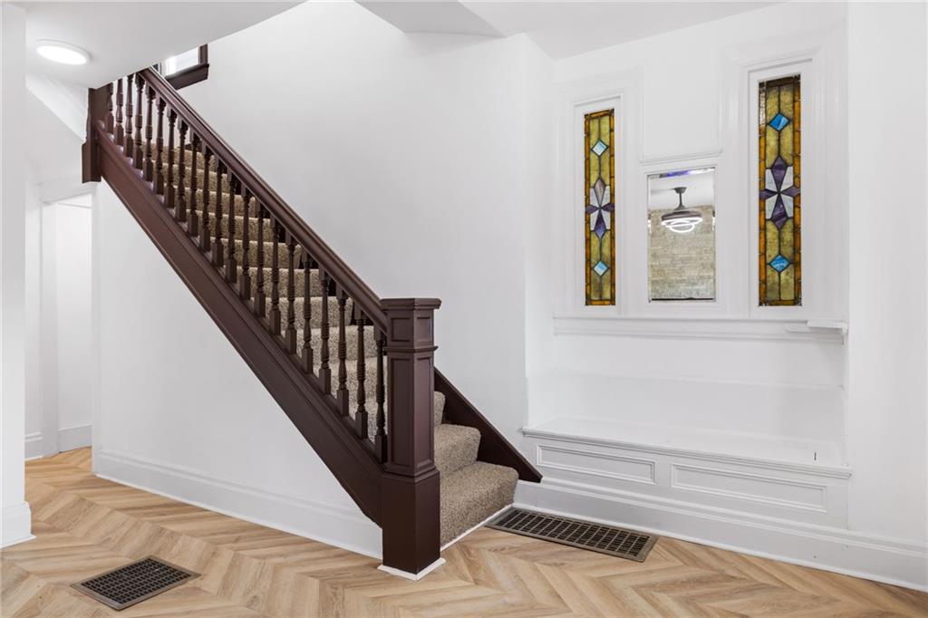 23 Craighead Street Pittsburgh, PA 15211 - Photo 6 of 35 a view of entryway and hall with wooden floor