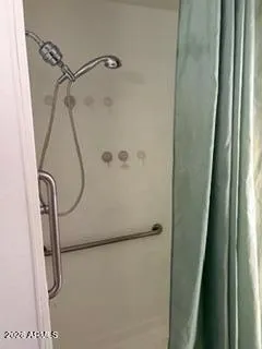 a bathroom with a glass shower door