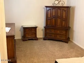 a view of room with furniture and cabinets