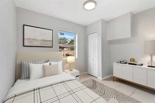 a bedroom with a bed and a cabinets