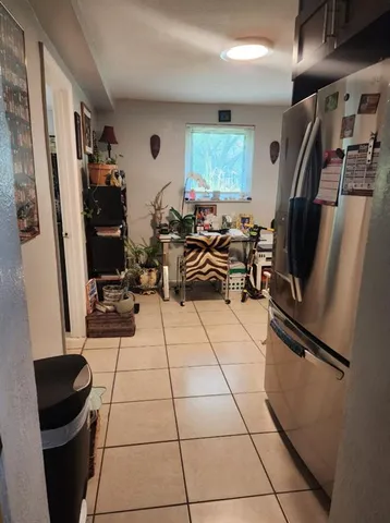 a view of a entryway with workspace and windows