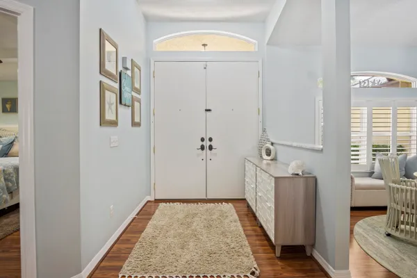 a view of a hallway with bathroom and shower