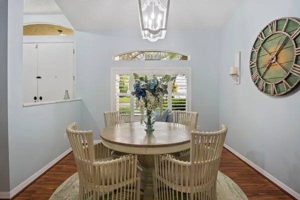 a dining room with furniture and window