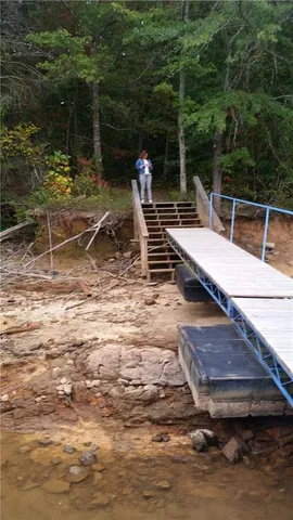 a view of a wooden deck with chairs