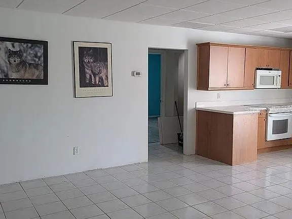 a view of an empty room with shelves