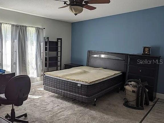 4402 Gallagher Road Plant City, FL 33565 - Photo 20 of 42 a bedroom with a bed and dresser