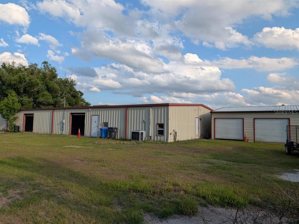 4402 Gallagher Road Plant City, FL 33565 - Photo 2 of 42 a big house with a big yard and large trees