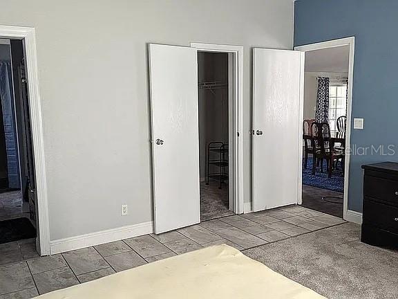 4402 Gallagher Road Plant City, FL 33565 - Photo 21 of 42 a view of an empty room with kitchen and a window