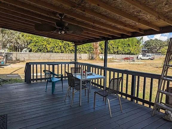 4402 Gallagher Road Plant City, FL 33565 - Photo 32 of 42 a view of a chairs and table on the wooden floor