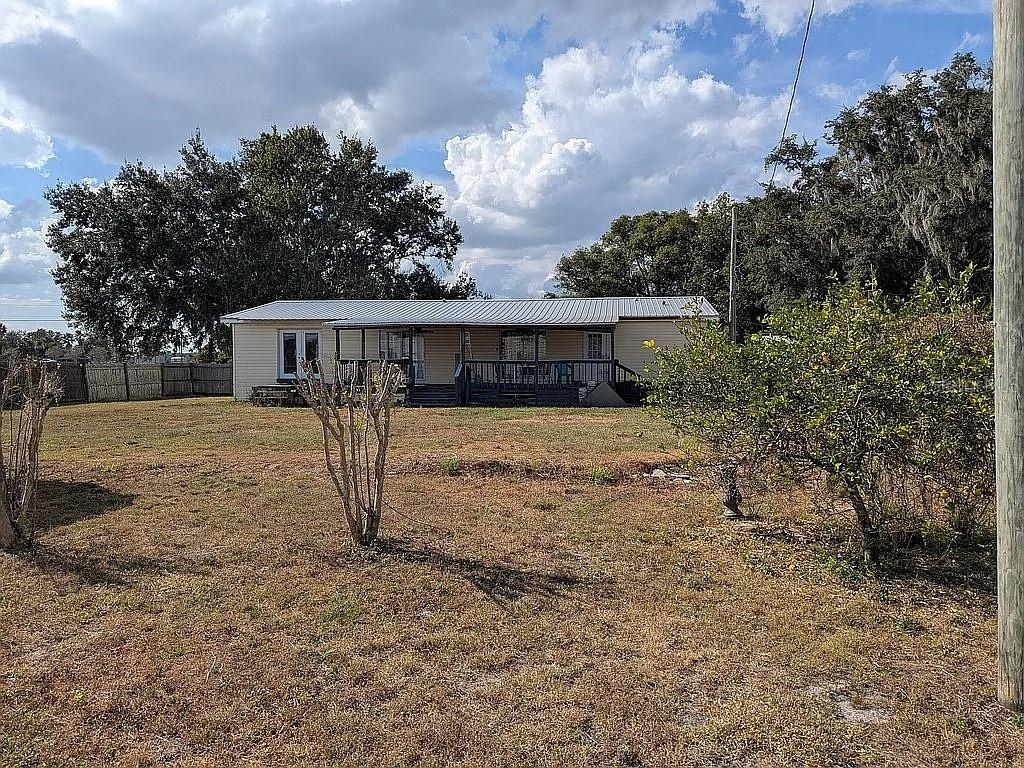 4402 Gallagher Road Plant City, FL 33565 - Photo 34 of 42 a view of a house with a yard and a large tree