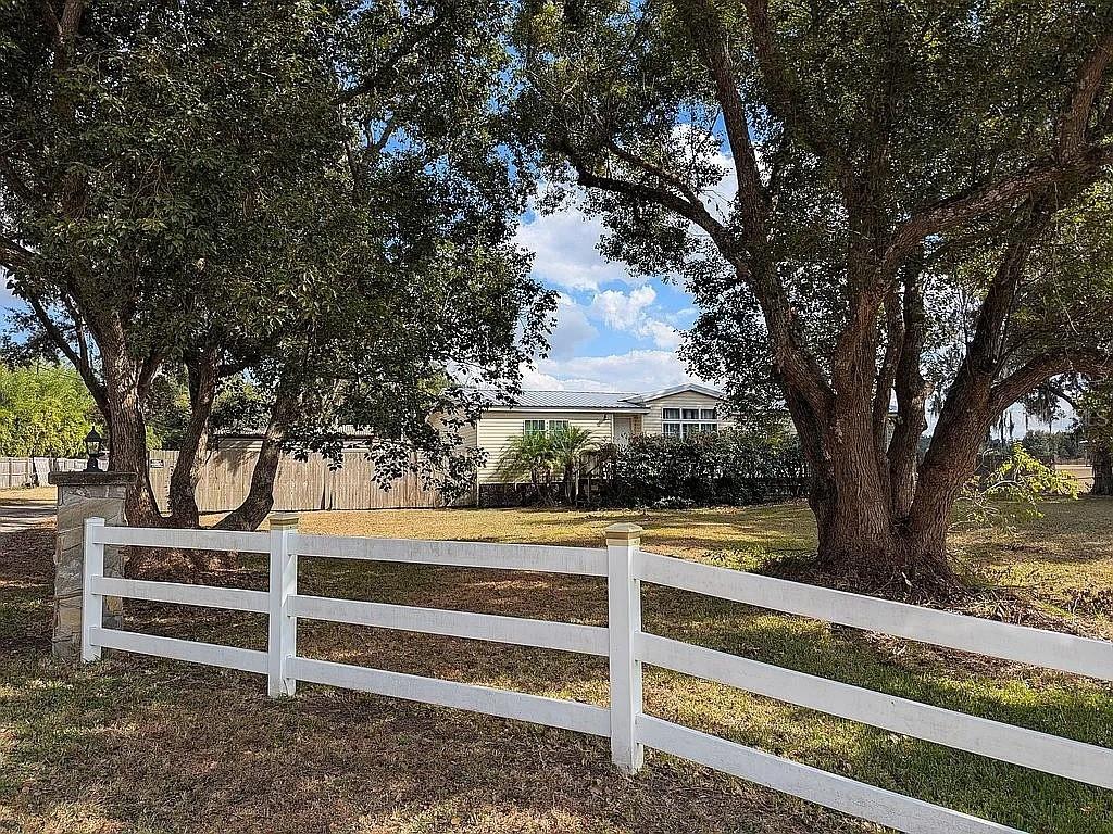 4402 Gallagher Road Plant City, FL 33565 - Photo 36 of 42 a view of a house with a large tree