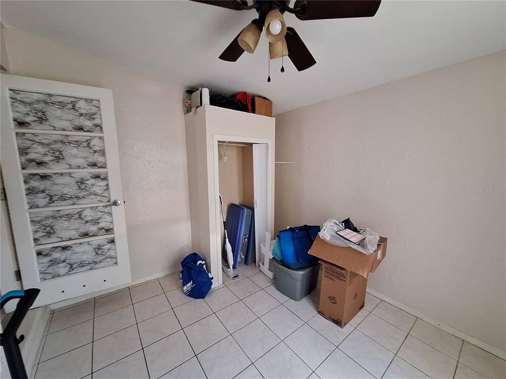 8564 Agress Avenue North Port, FL 34287 - Photo 11 of 18 a bed room with furniture and a window
